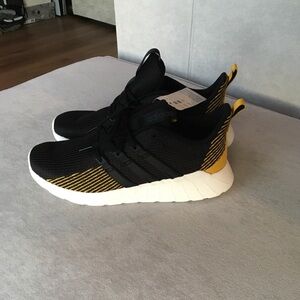 Adidas Black and Yellow Sneakers with Sock-Like Fit